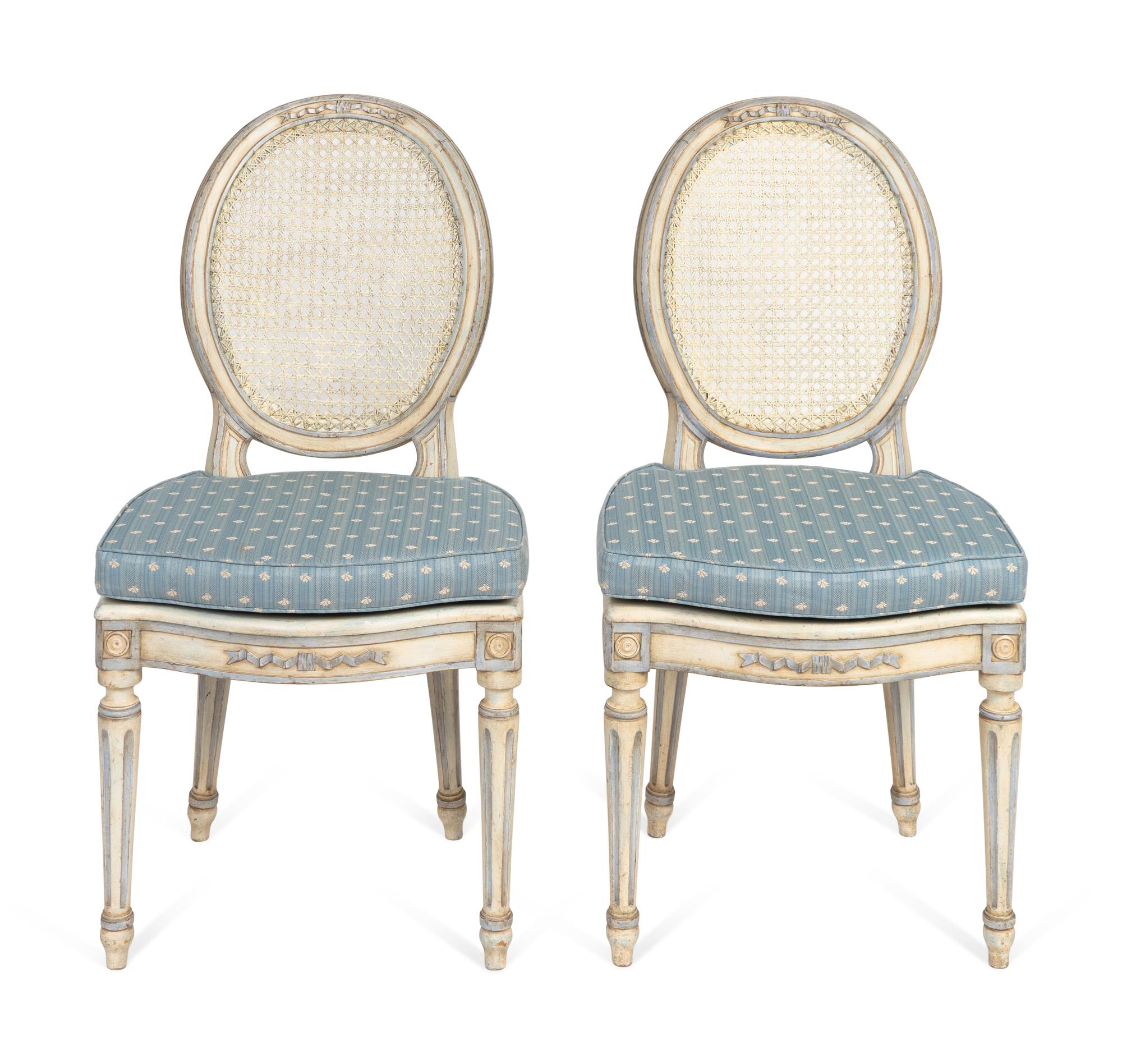 A Pair of Louis XVI Style White-Painted and Caned Chaises