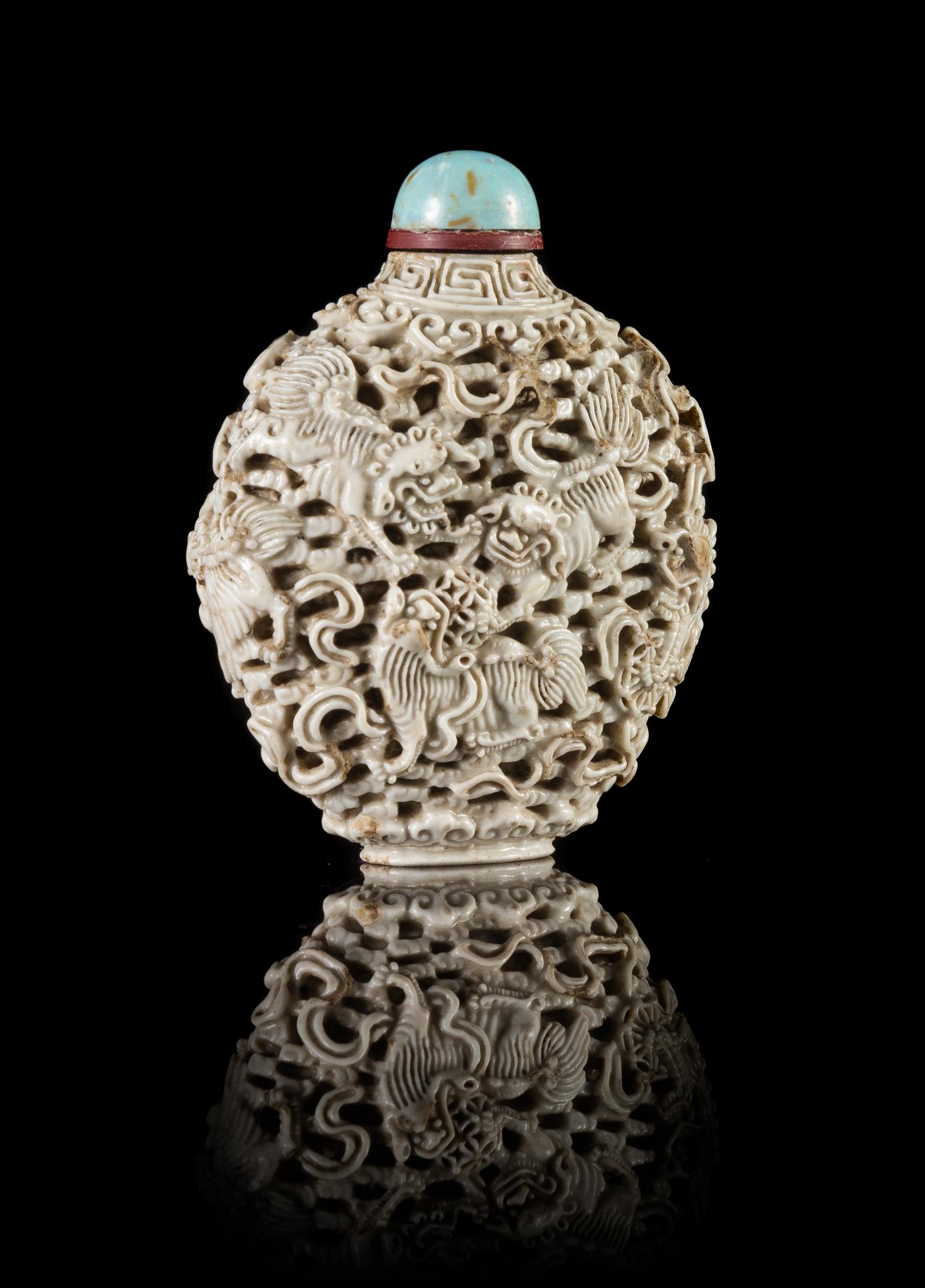 A White Glazed Molded Porcelain Snuff Bottle — JIAQING PERIOD (1796-1820)