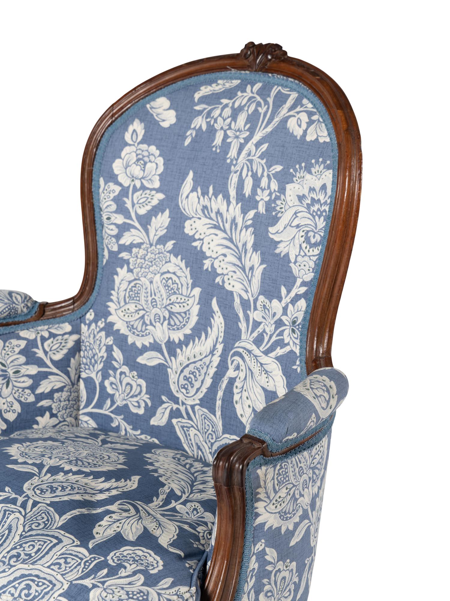 A Pair of Louis XV Walnut Bergères