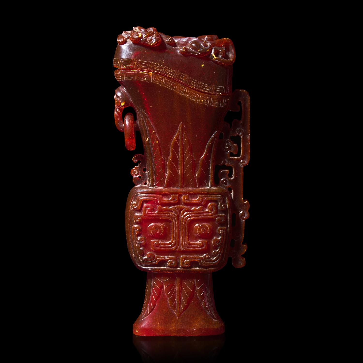 A Chinese Carved Amber Archaistic Gong Vase and Cover, Late Qing Dynasty 清晚期 琥珀仿古觥