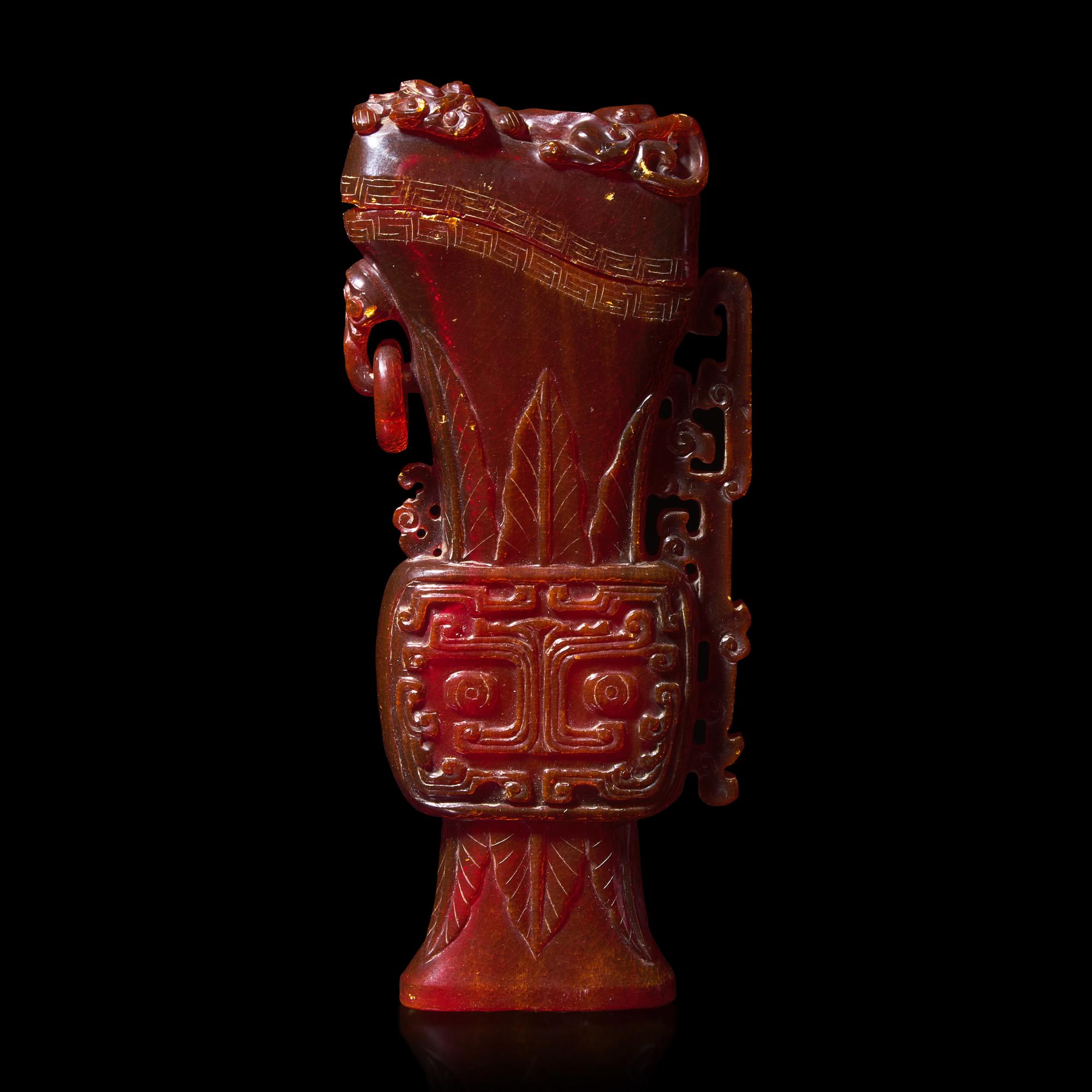 A Chinese Carved Amber Archaistic Gong Vase and Cover, Late Qing Dynasty 清晚期 琥珀仿古觥