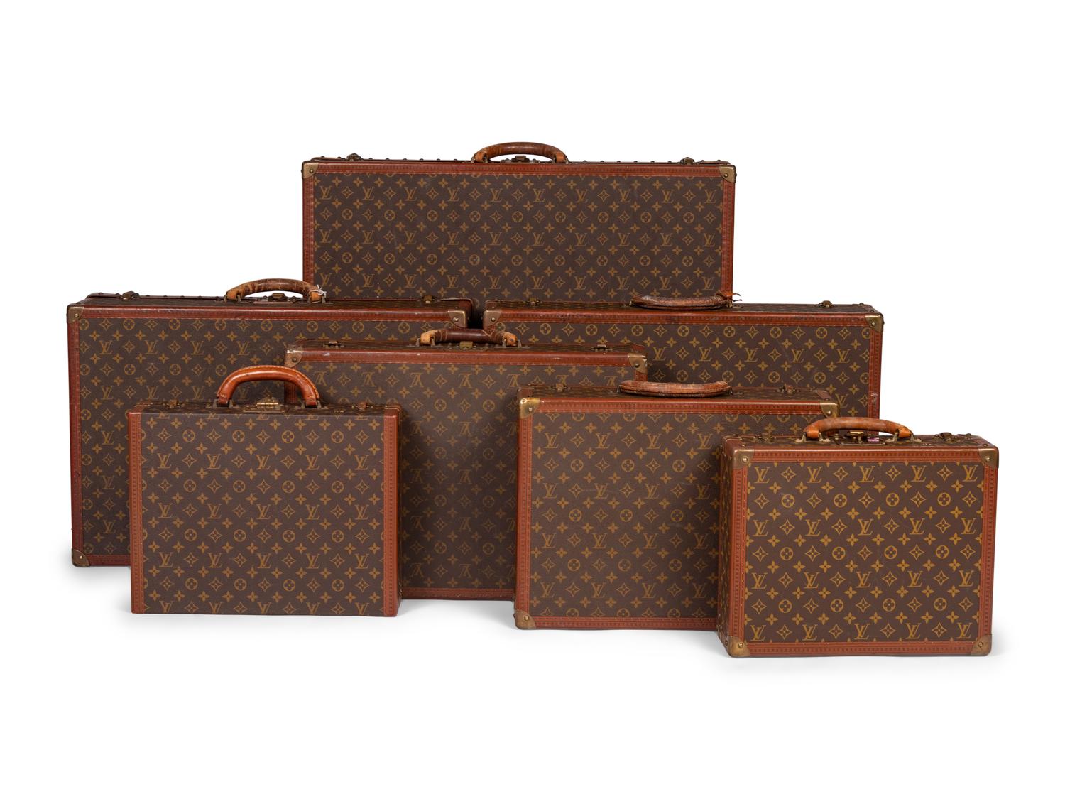 A Group of Seven Louis Vuitton Hardside Suitcases