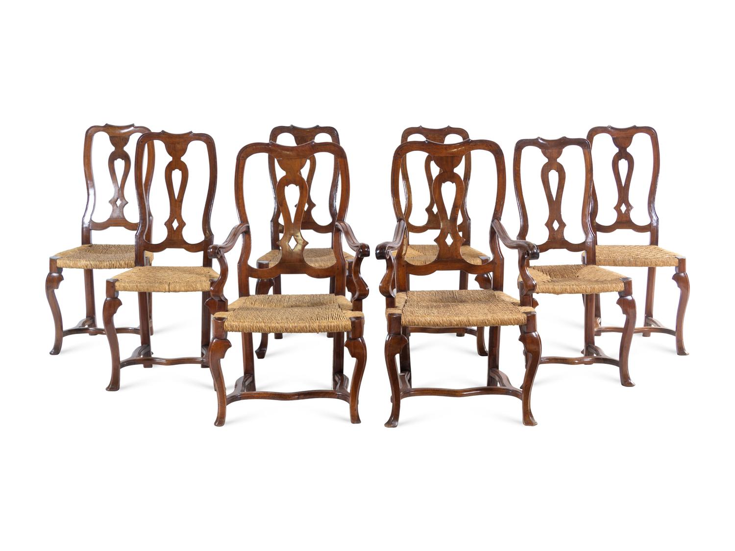 A Set of Eight Italian Walnut Rush-Seat Dining Chairs