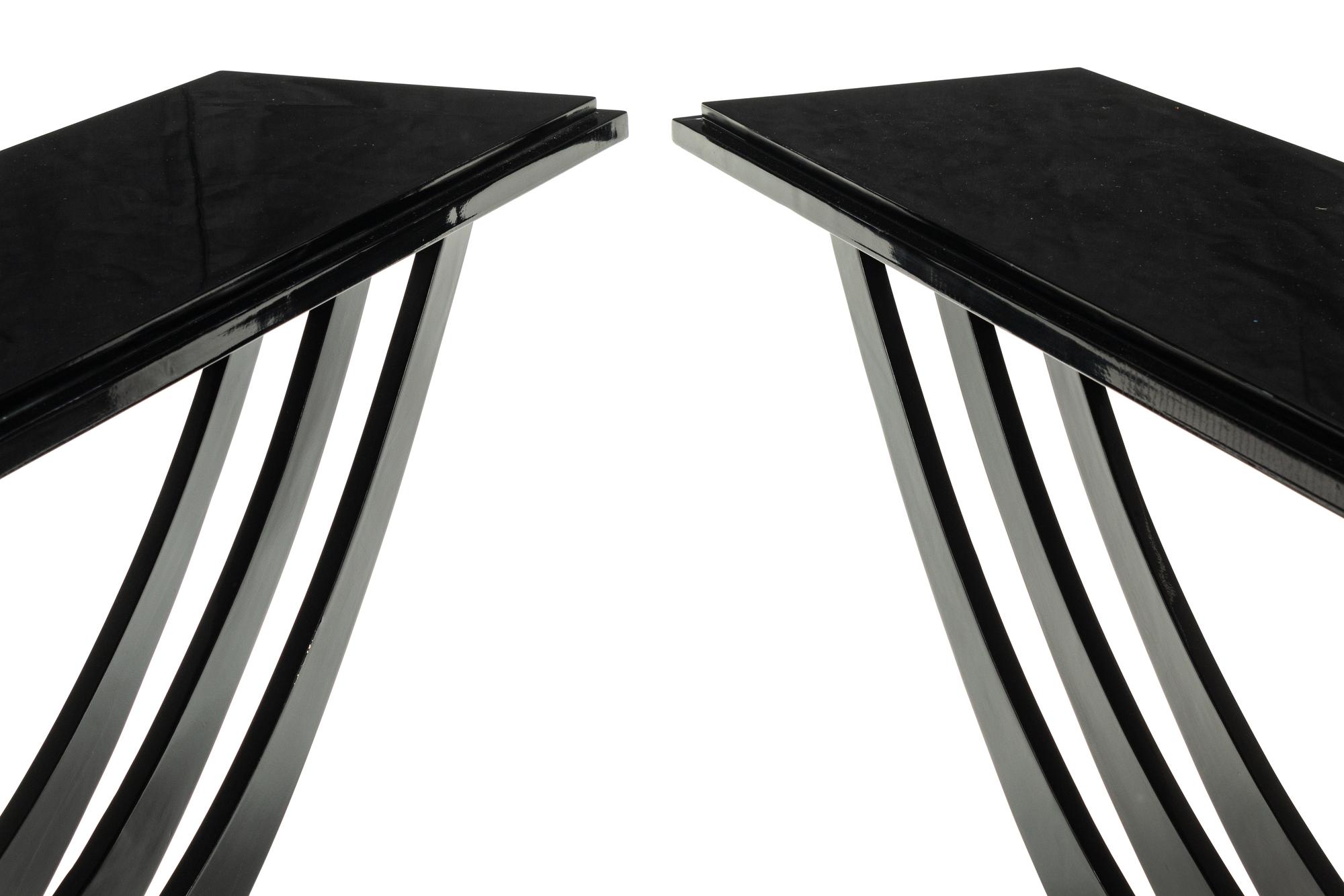 A Pair of Art Deco Style Black-Painted and Parcel Gilt Console Tables