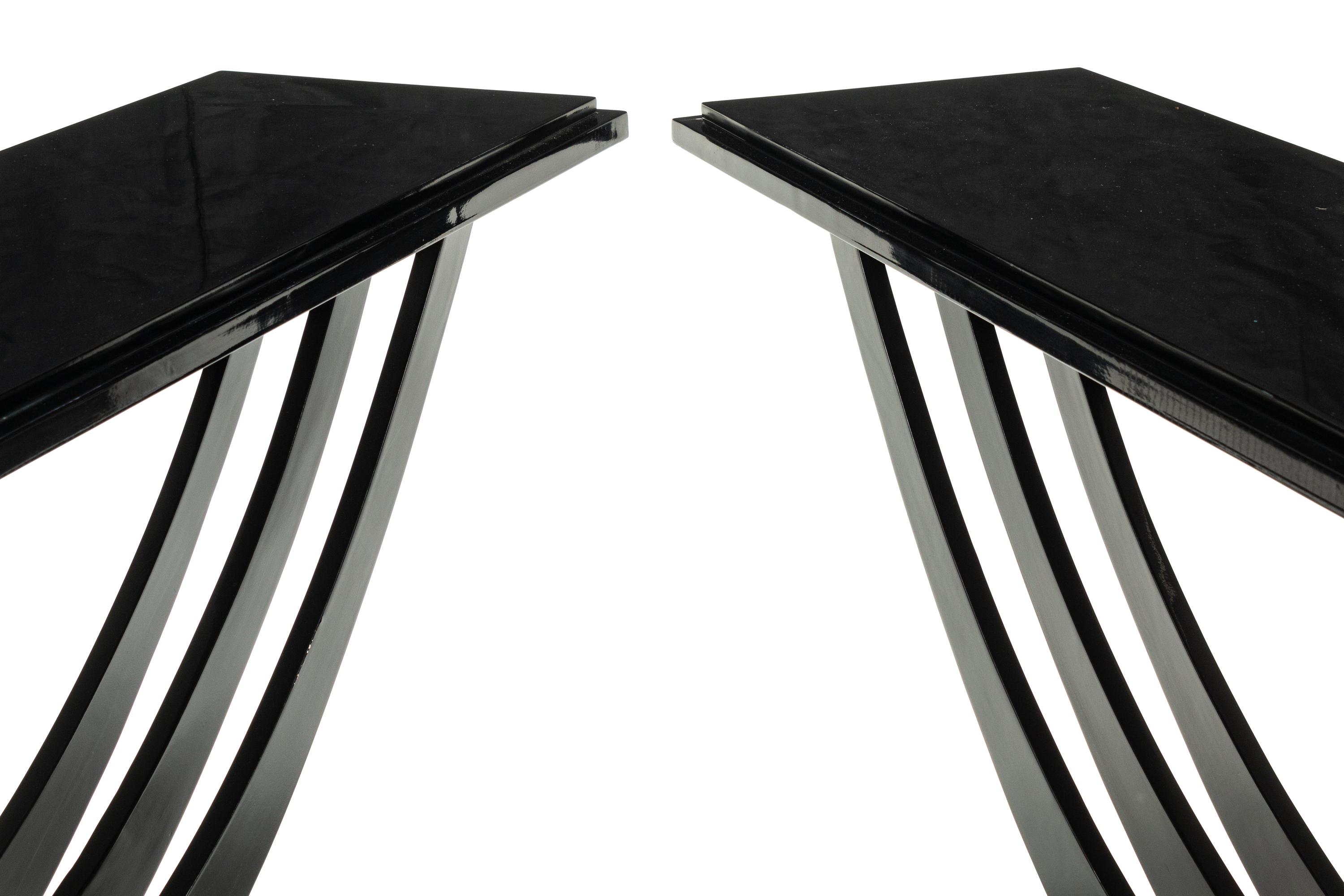 A Pair of Art Deco Style Black-Painted and Parcel Gilt Console Tables