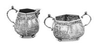 A Dutch Silver Creamer and Sugar Set, , each decorated with nautical scenes.