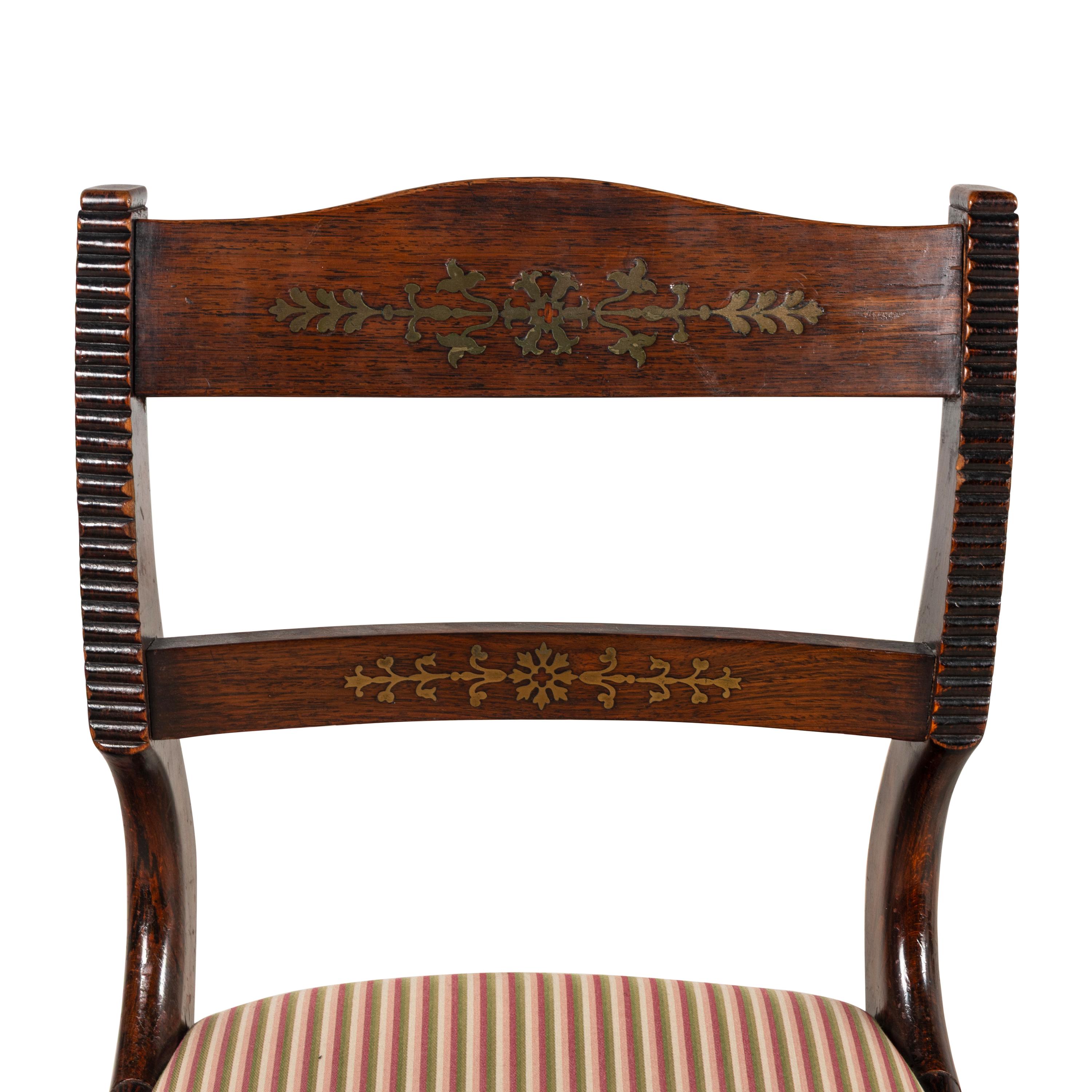 A Set of Eight Regency Brass Inlaid Mahogany Dining Chairs