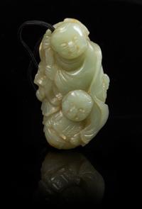 A Carved Celadon Jade Toggle Length 2 1/4 inches.