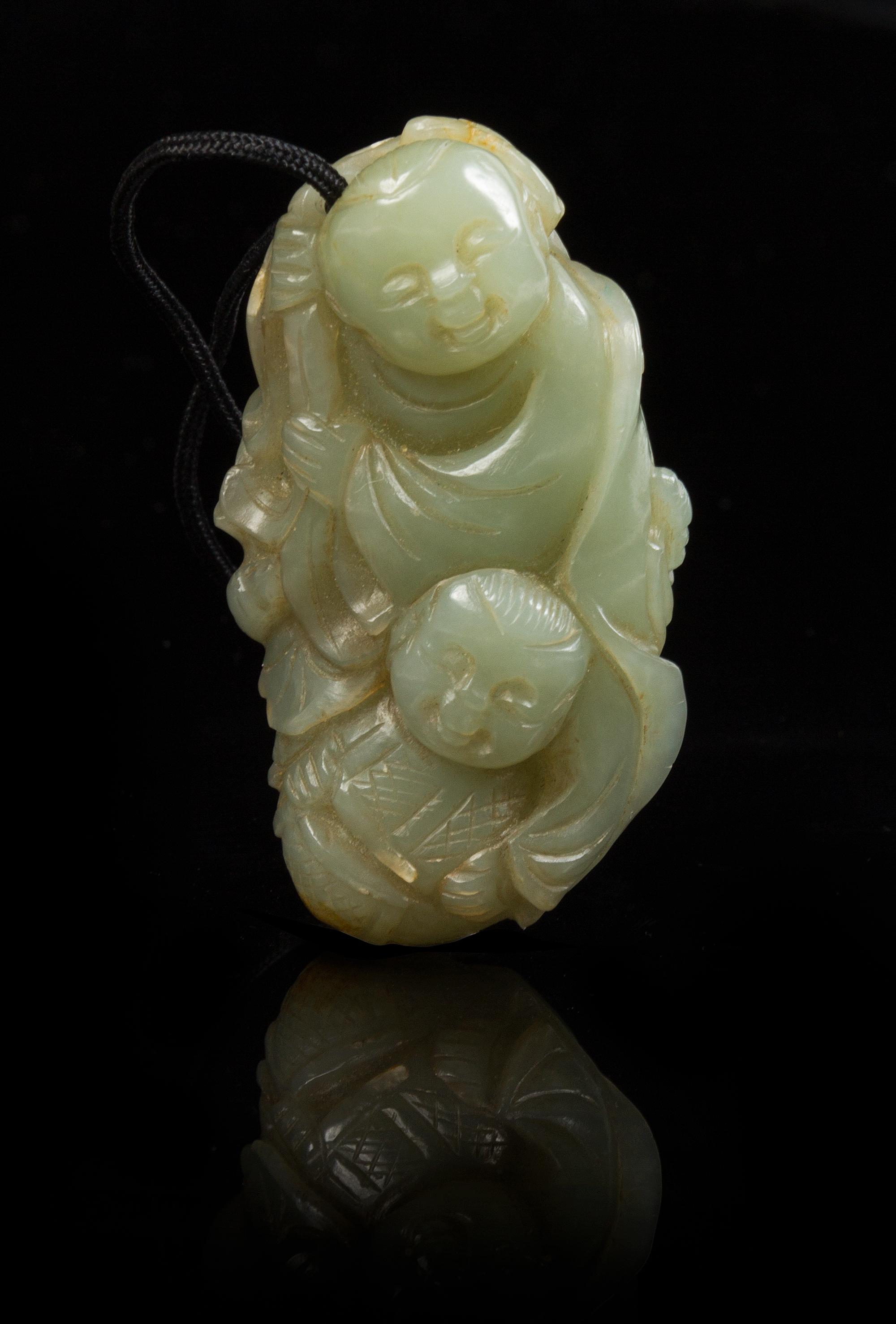 A Carved Celadon Jade Toggle Length 2 1/4 inches.
