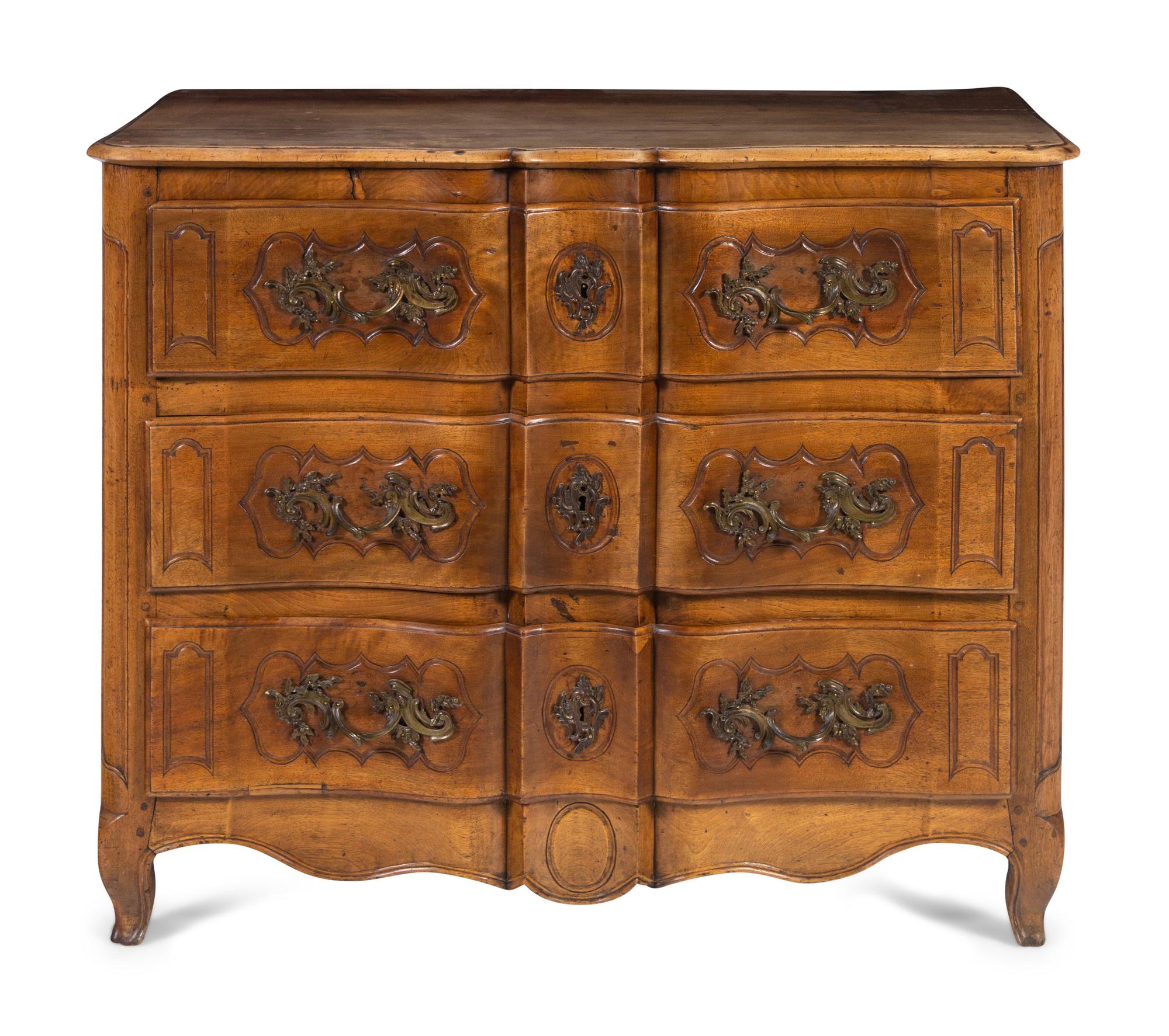 A Louis XV Provincial Walnut Serpentine-Front Commode