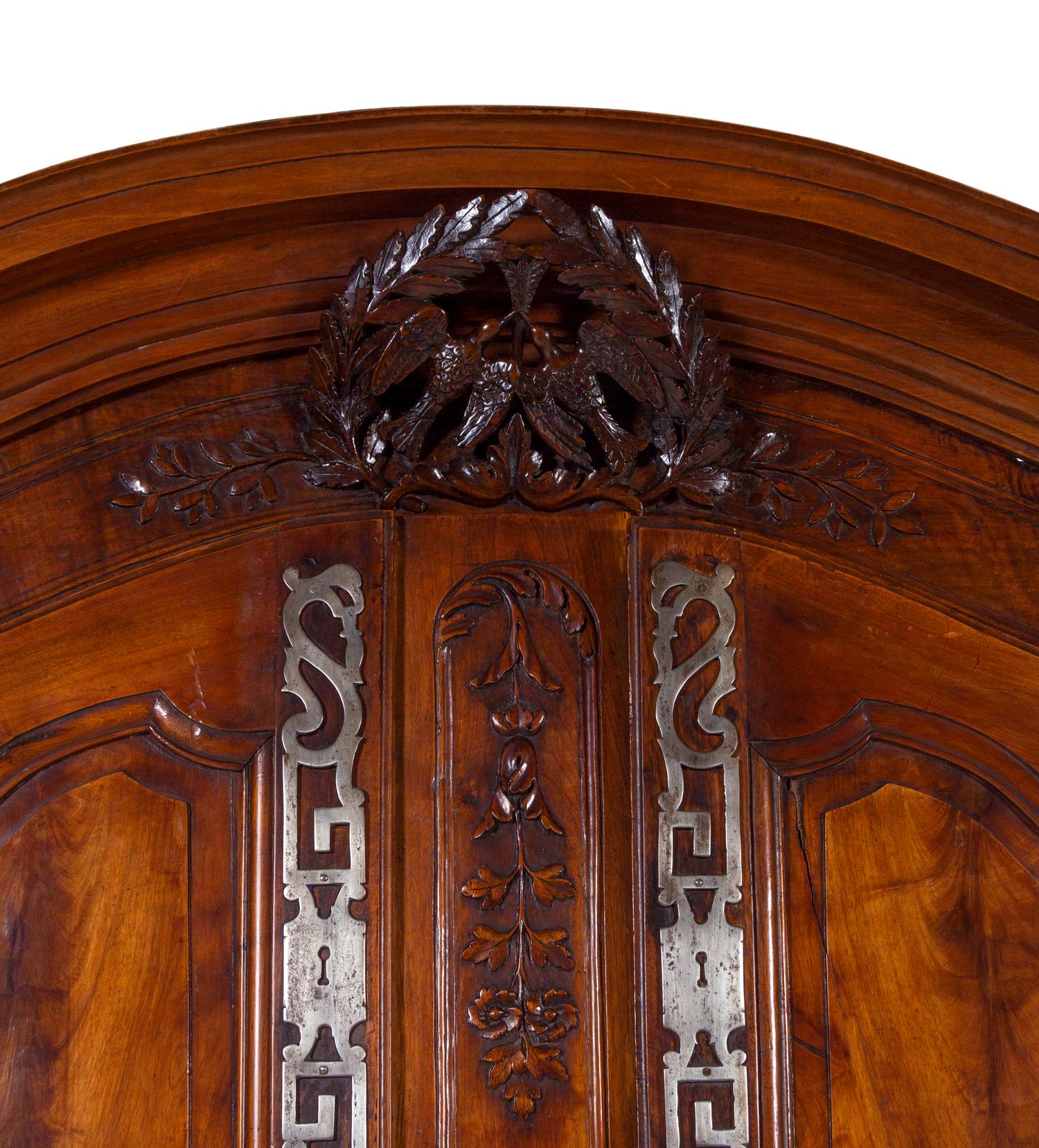 A Louis XV Provincial Carved Walnut Armoire