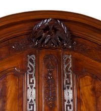 A Louis XV Provincial Carved Walnut Armoire