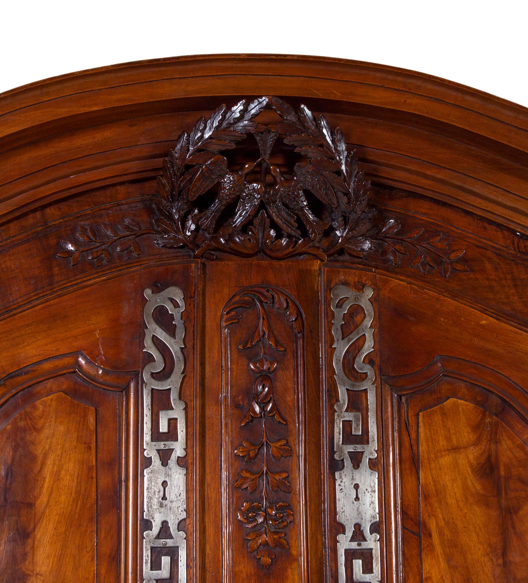 A Louis XV Provincial Carved Walnut Armoire