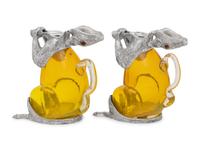 A Pair of Silver-Plate and Yellow Glass Squirrel Decanters