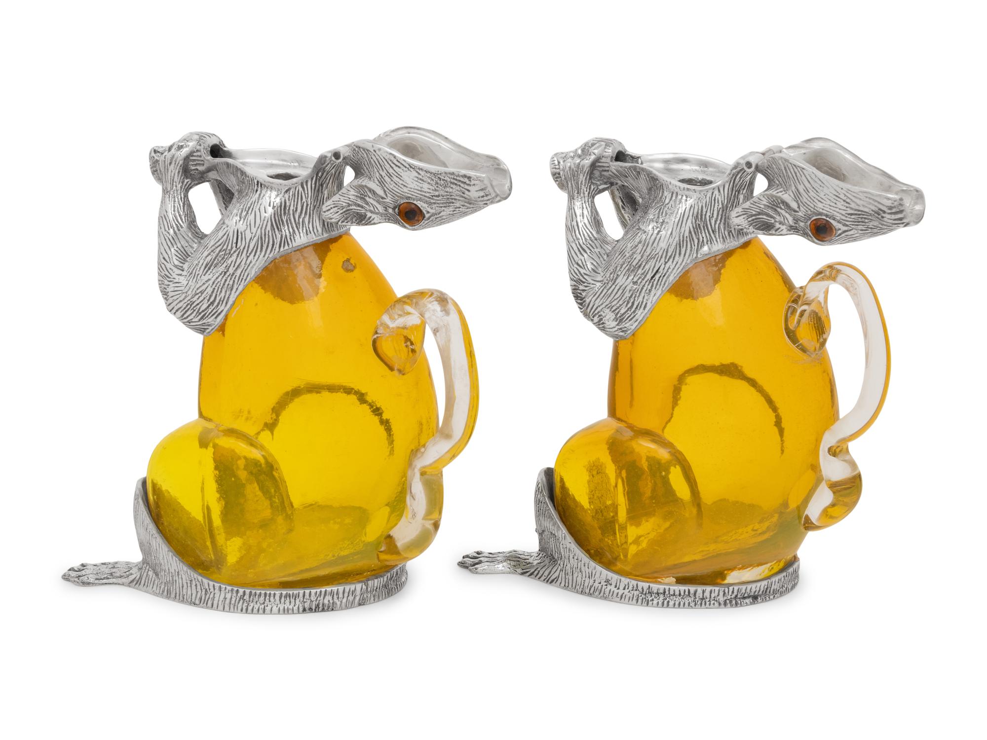 A Pair of Silver-Plate and Yellow Glass Squirrel Decanters