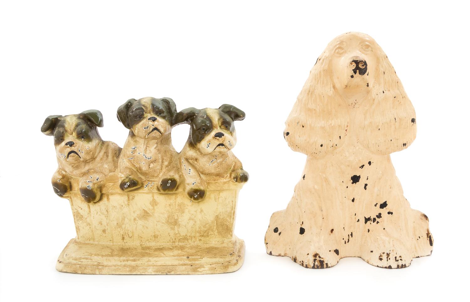 Two Cast Iron Doorstops Height of tallest 9 inches.
