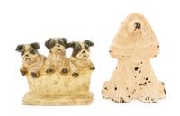 Two Cast Iron Doorstops Height of tallest 9 inches.