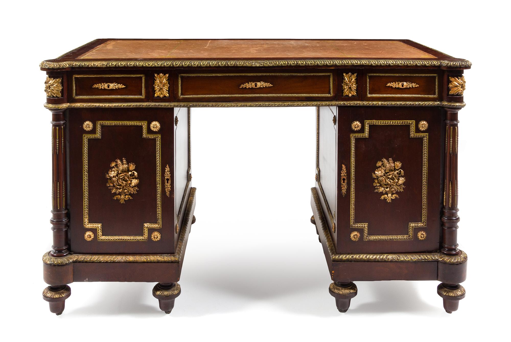 An Empire Style Gilt Metal Mounted Mahogany Pedestal Desk Height 31 1/2 x width 50 x depth 27 1/2 inches. — 20TH CENTURY
