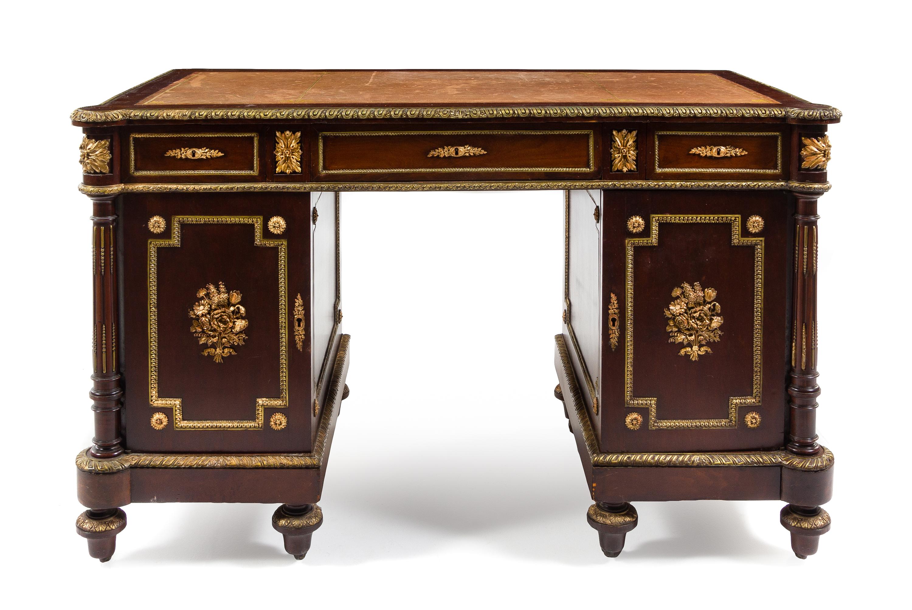 An Empire Style Gilt Metal Mounted Mahogany Pedestal Desk Height 31 1/2 x width 50 x depth 27 1/2 inches. — 20TH CENTURY
