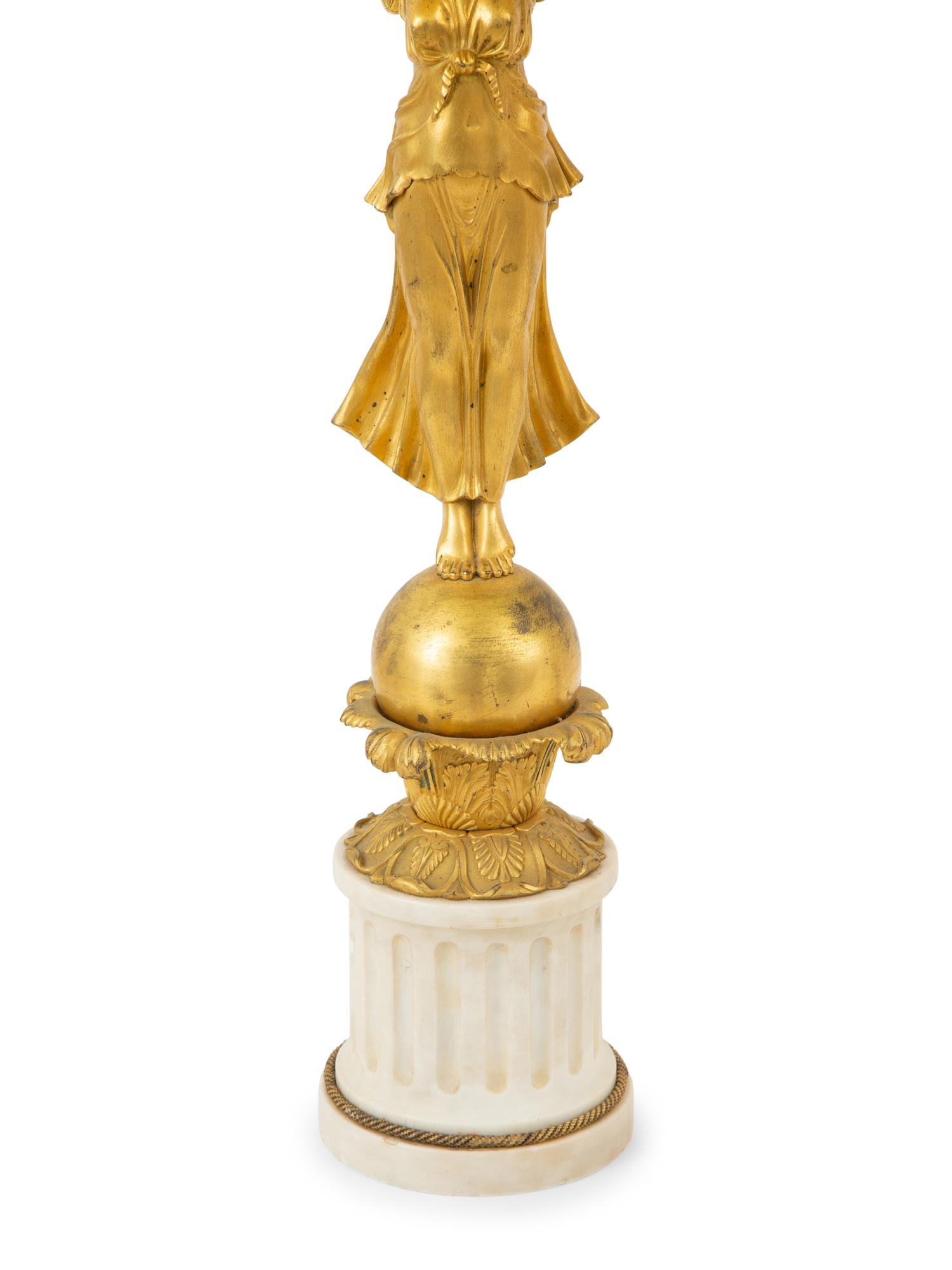 A Pair of Empire Style Gilt Bronze and White Marble Table Lamps