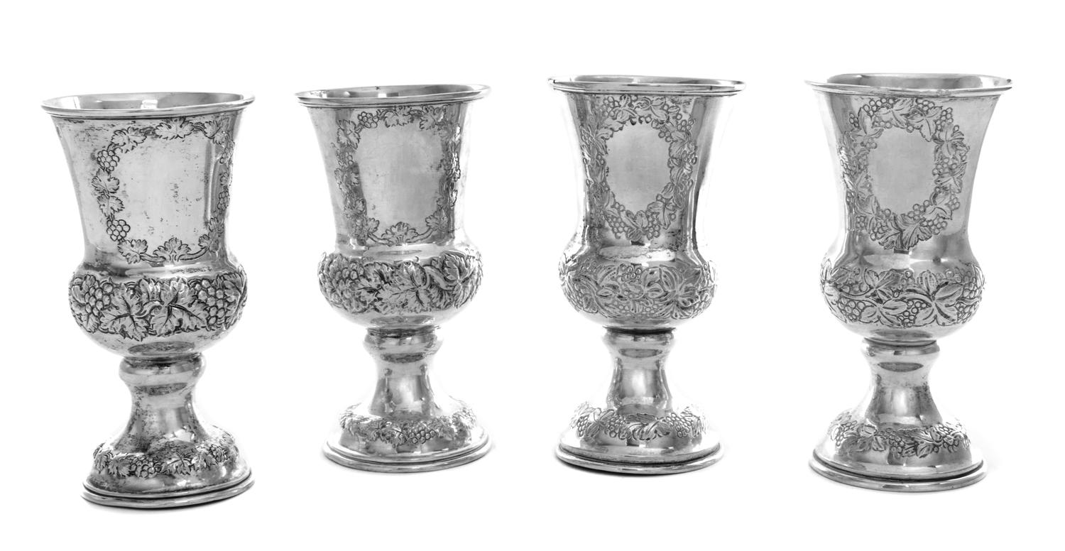 A Set of Four Austrian Silver Wine Goblets, Maker's Mark AK, Vienna, 1865/6, each having grape cluster and vine decorated banding.