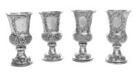 A Set of Four Austrian Silver Wine Goblets, Maker's Mark AK, Vienna, 1865/6, each having grape cluster and vine decorated banding.