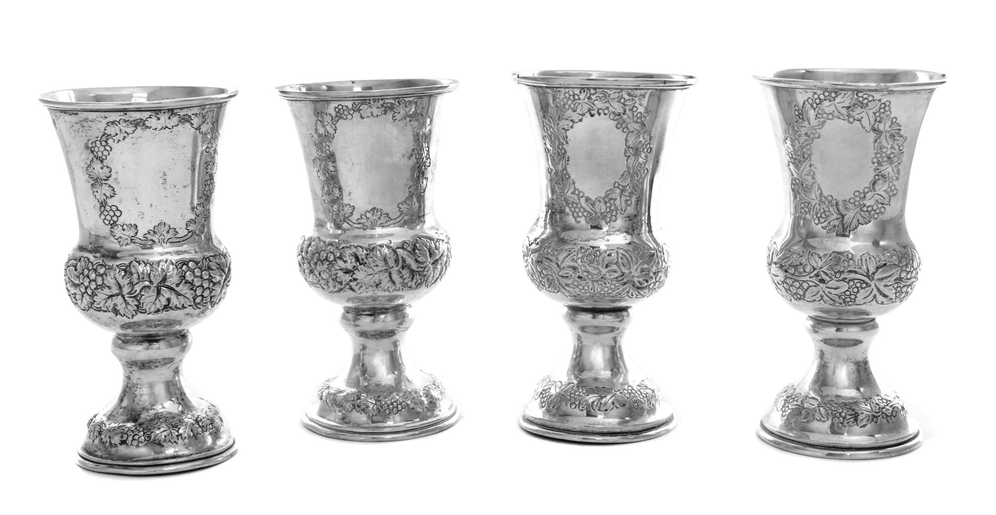 A Set of Four Austrian Silver Wine Goblets, Maker's Mark AK, Vienna, 1865/6, each having grape cluster and vine decorated banding.