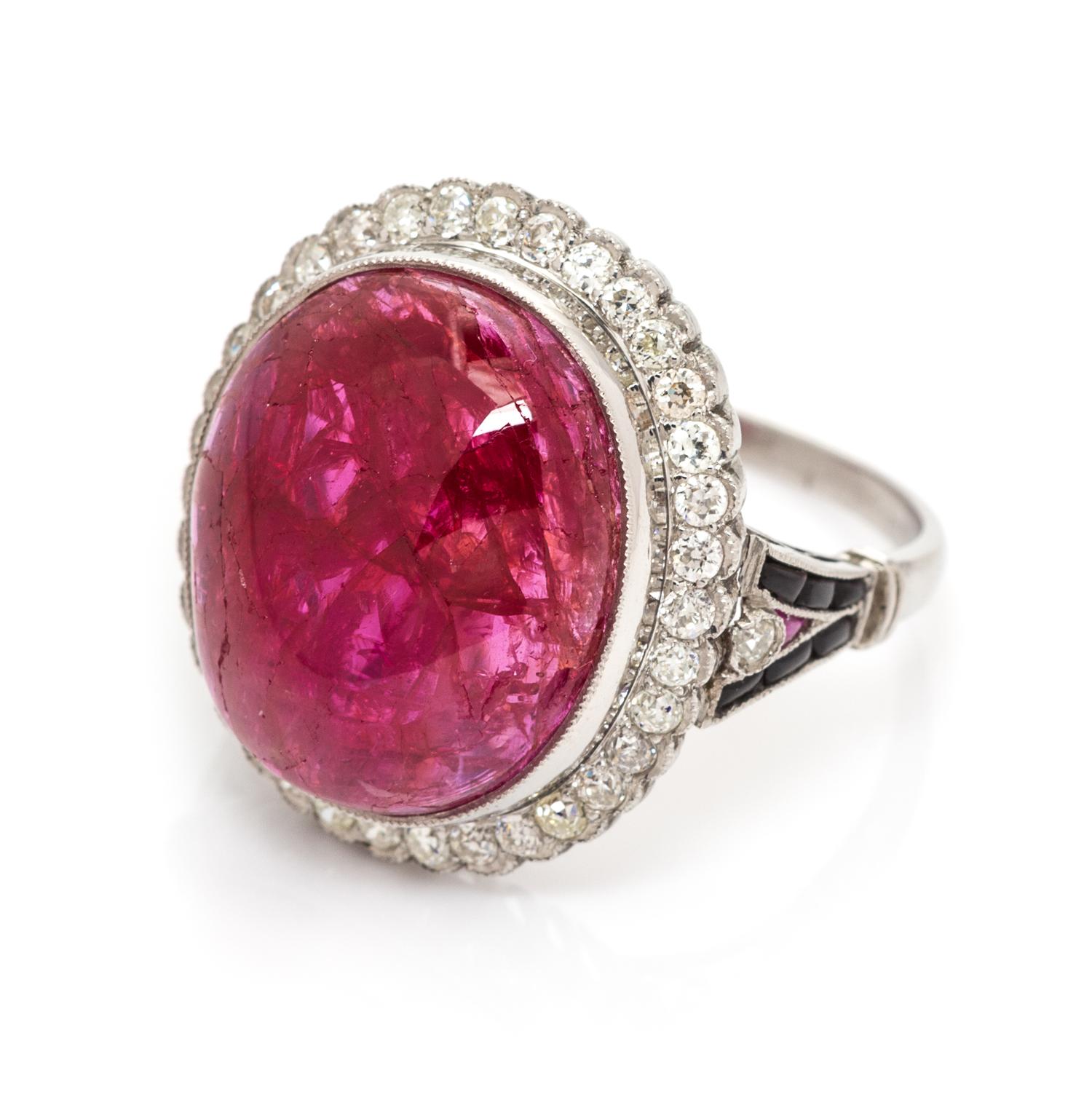 An Art Deco Platinum, Ruby, Diamond and Onyx Ring, 5.00 dwts.