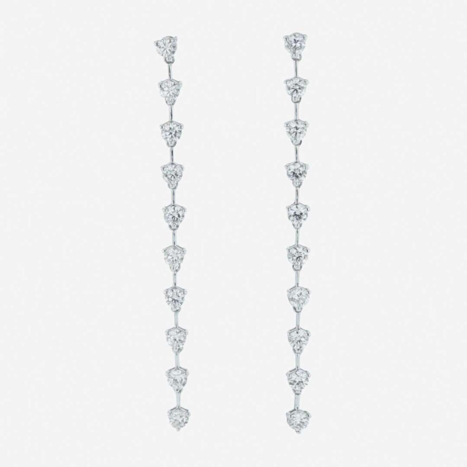 A pair of 18K white gold and diamond dangle earrings