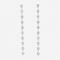 A pair of 18K white gold and diamond dangle earrings