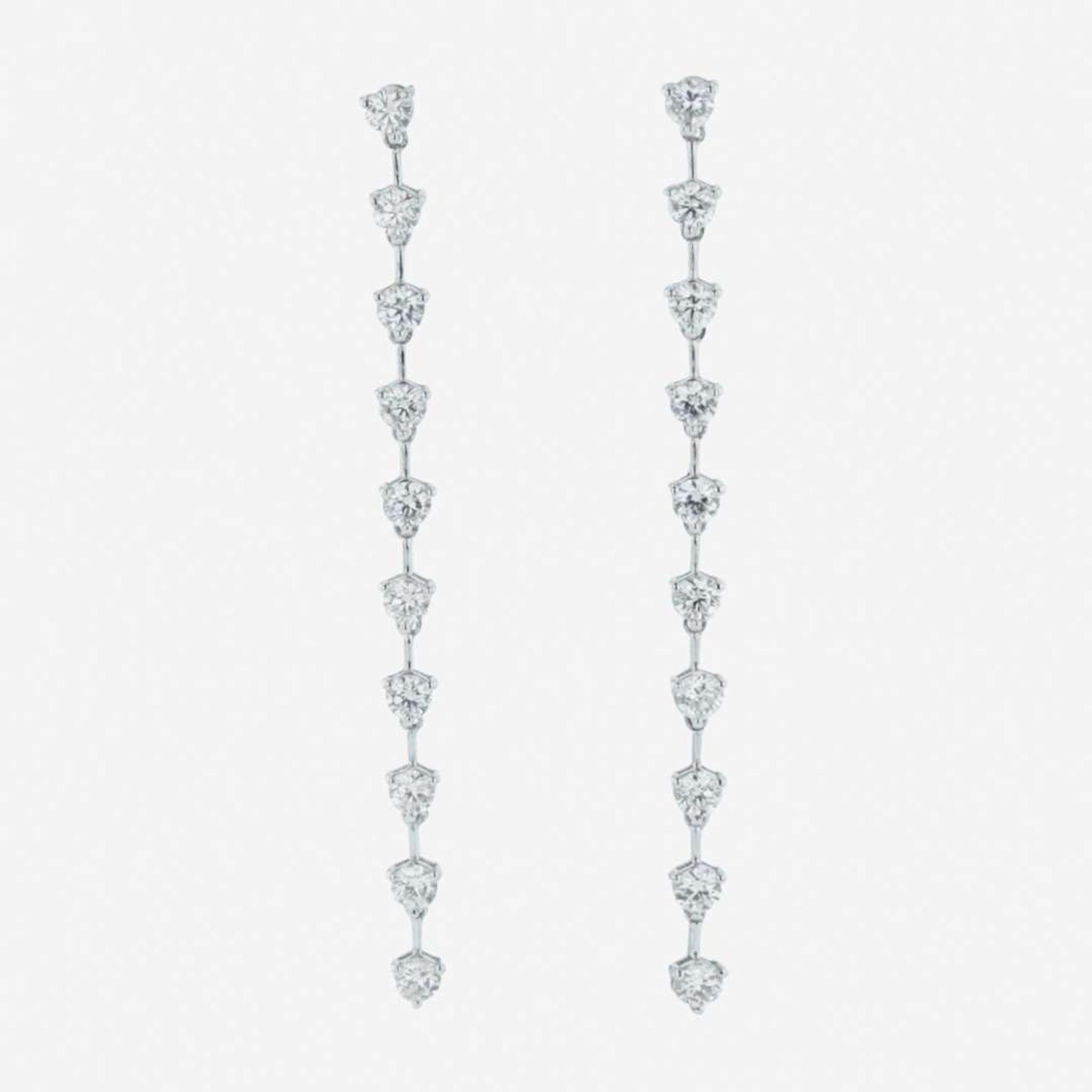 A pair of 18K white gold and diamond dangle earrings