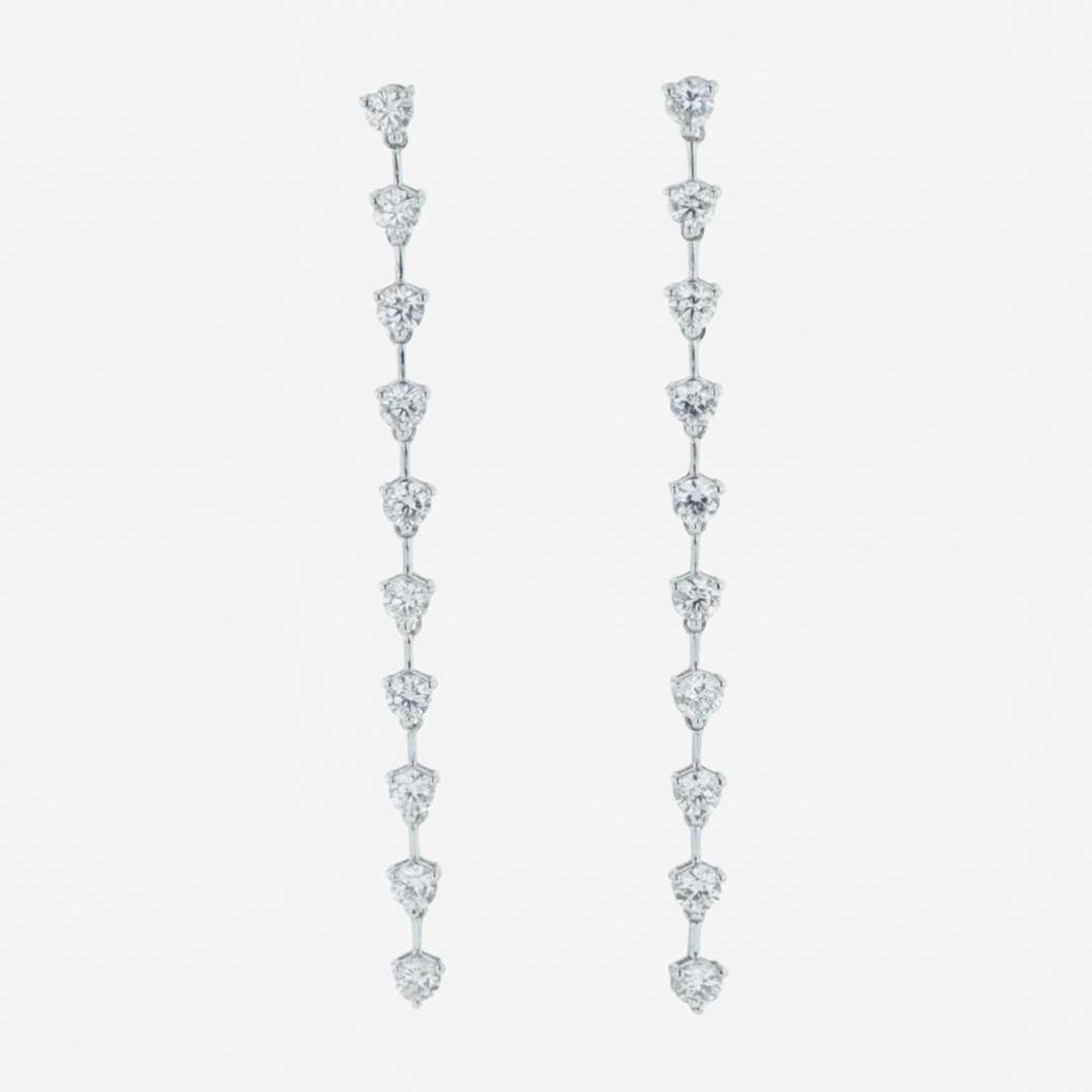A pair of 18K white gold and diamond dangle earrings