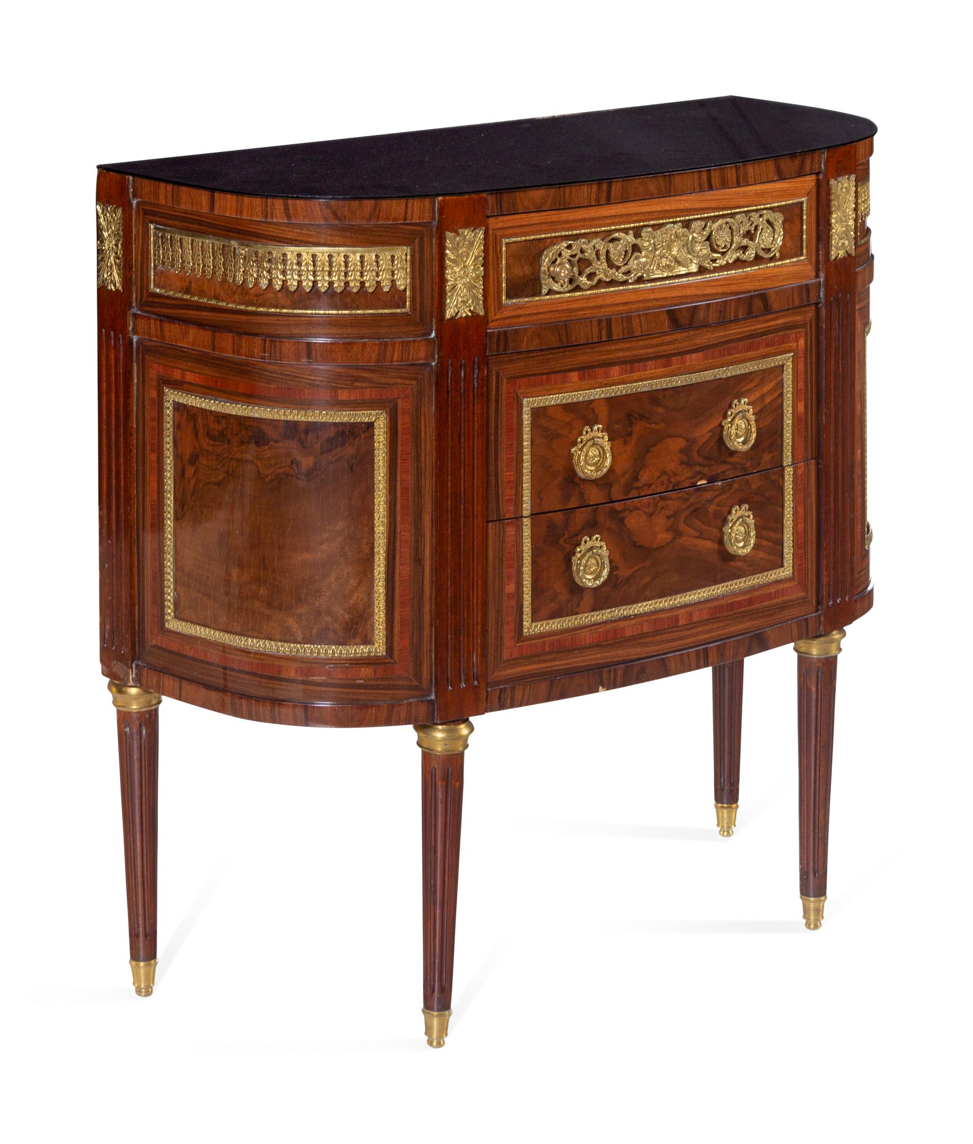 A Louis XVI Style Gilt Bronze Mounted Chest of Drawers