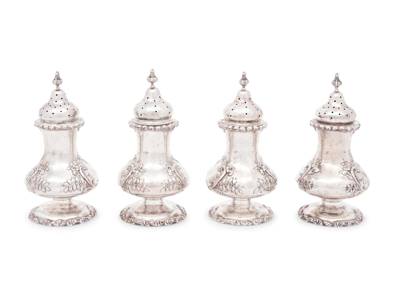 A Group of Sixteen Silver Casters
