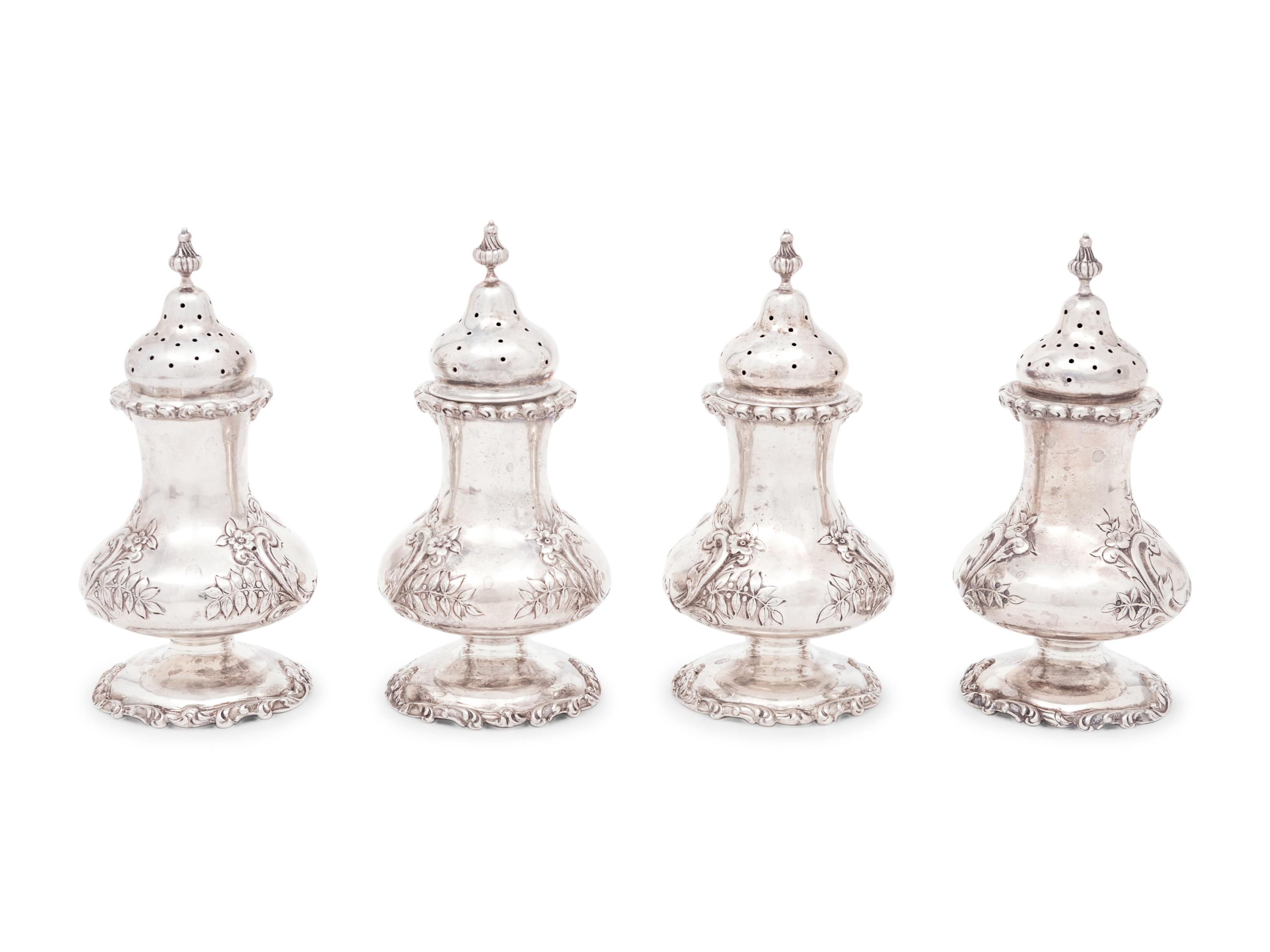 A Group of Sixteen Silver Casters