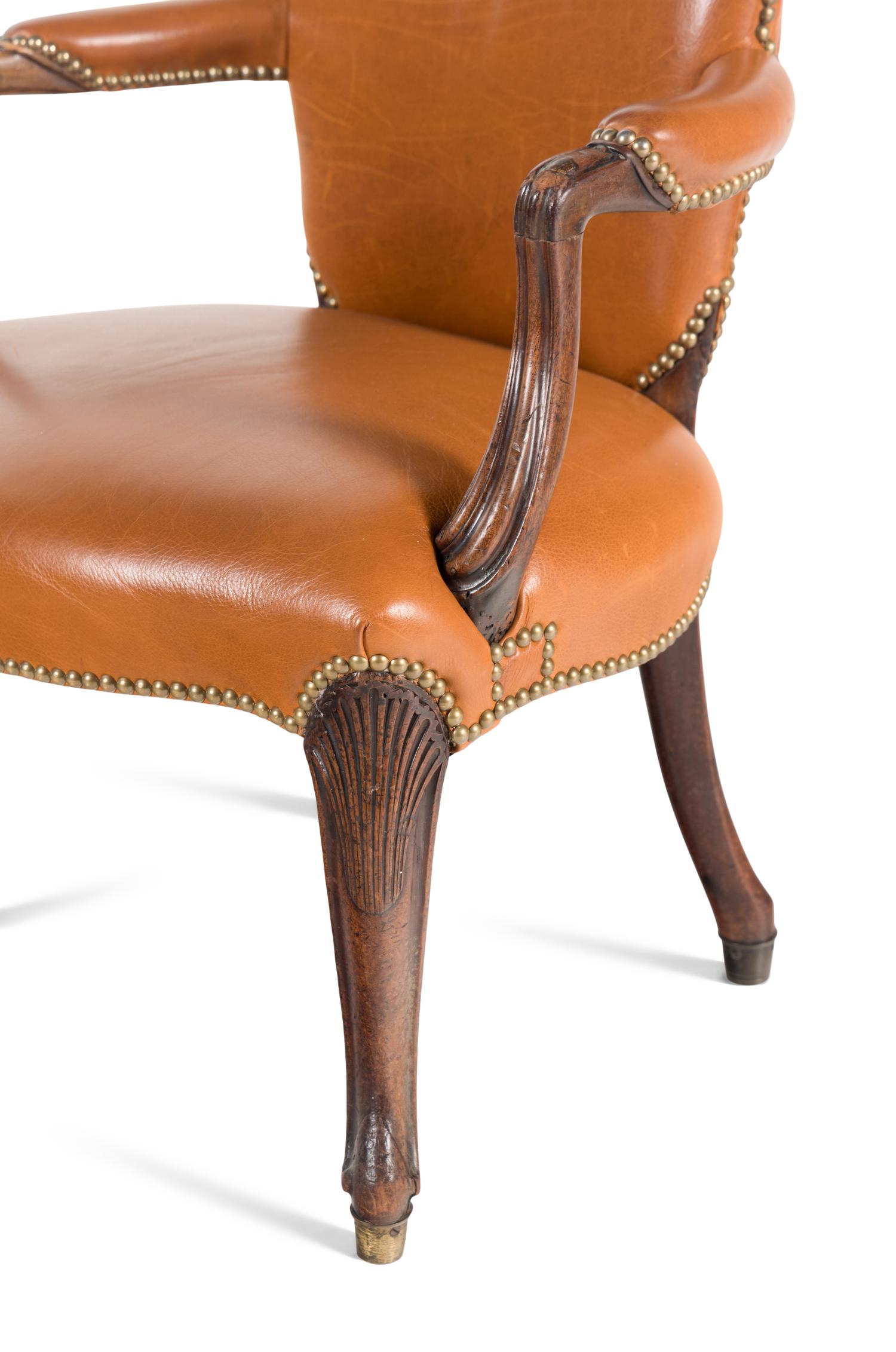 A Near Pair of George III Mahogany Leather-Upholstered Armchairs