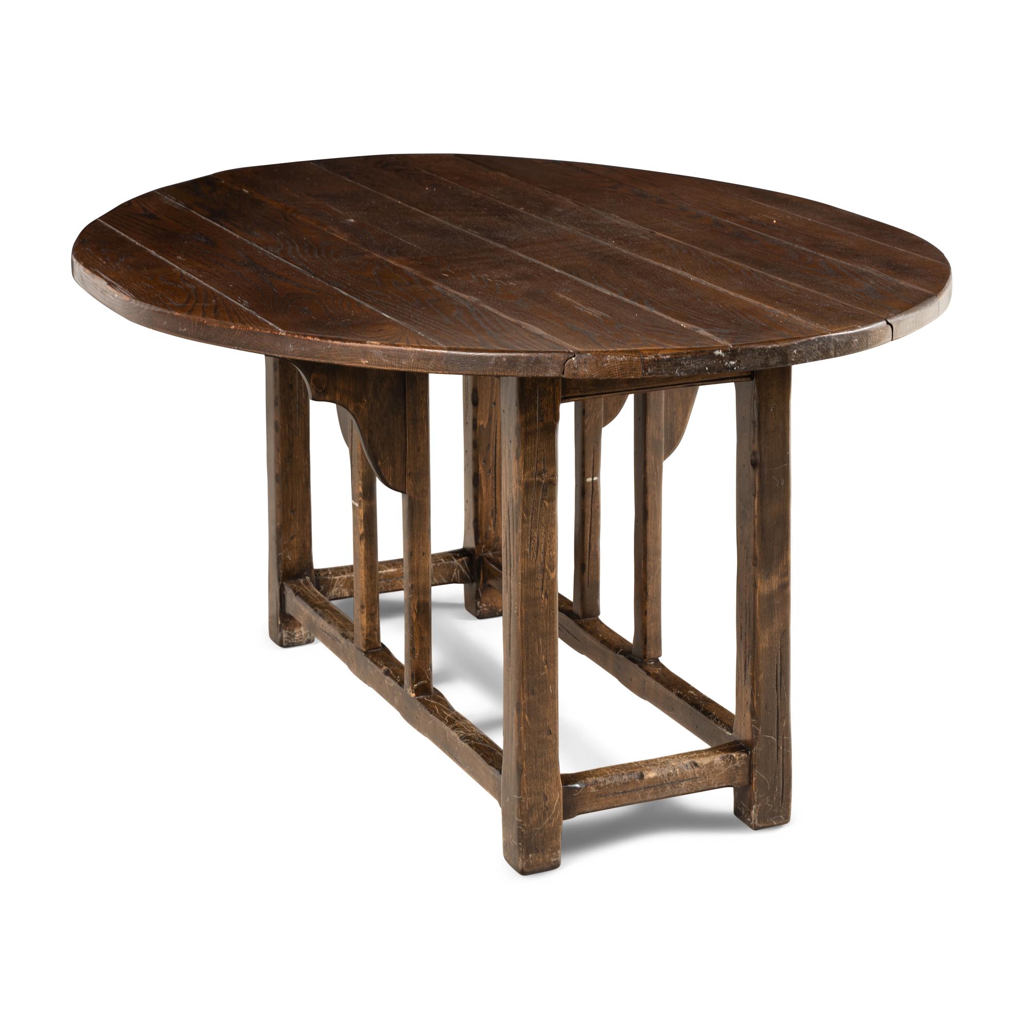 An Assembled English Oak Dining Set