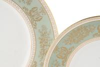 A Wedgwood Gold Columbia Porcelain Dinner Service