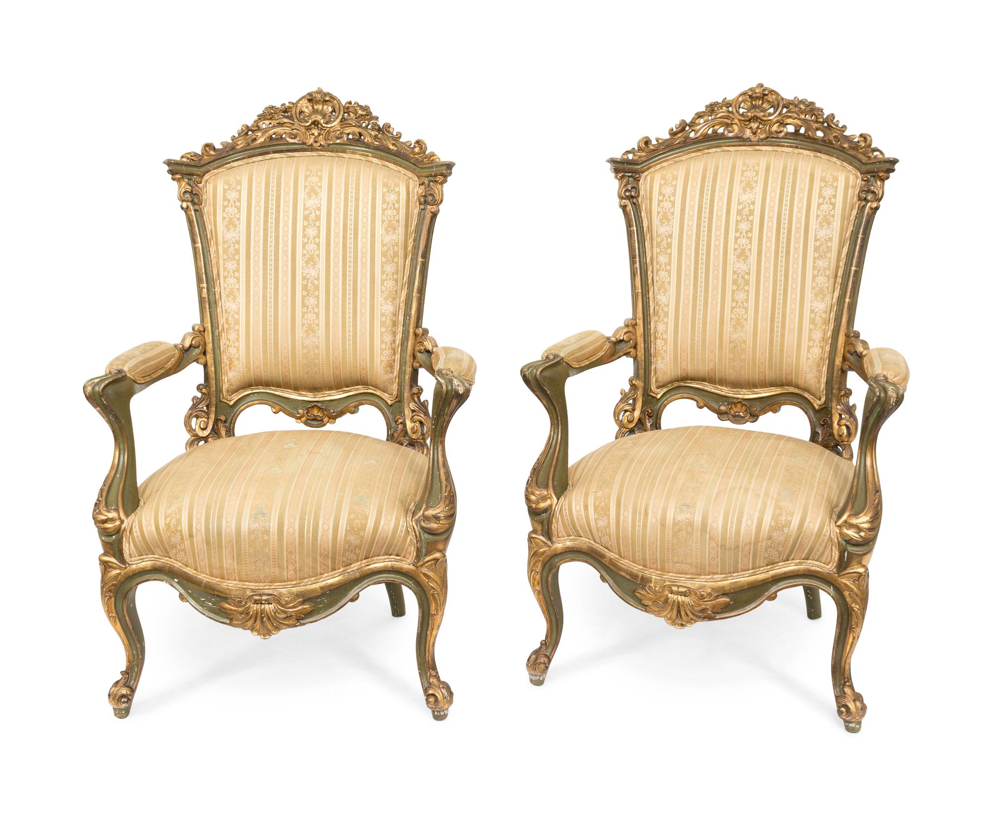 A Pair of Venetian Carved Parcel Gilt Armchairs