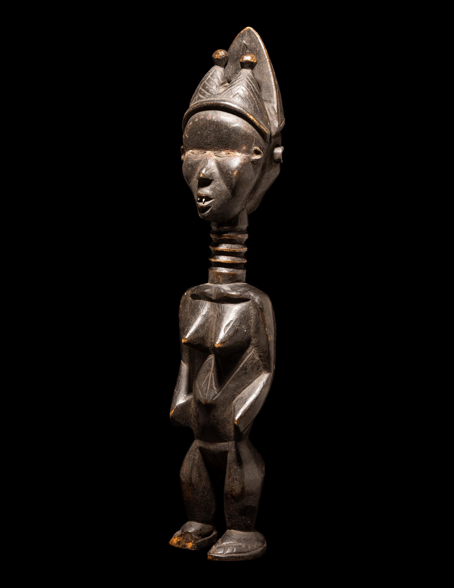 A Baule Wood Janus-Headed Figure