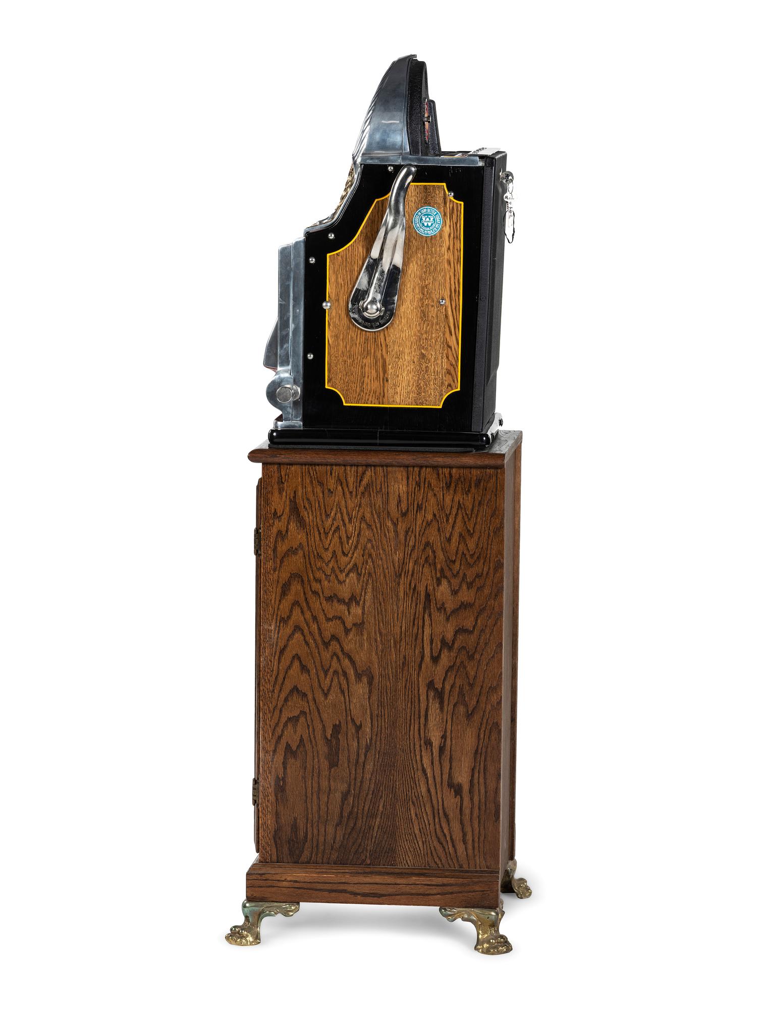 A 5 Cent Rol-A-Top Twin Jackpot Slot Machine on Reverse Printed Glass Inset Golden Nugget Stand