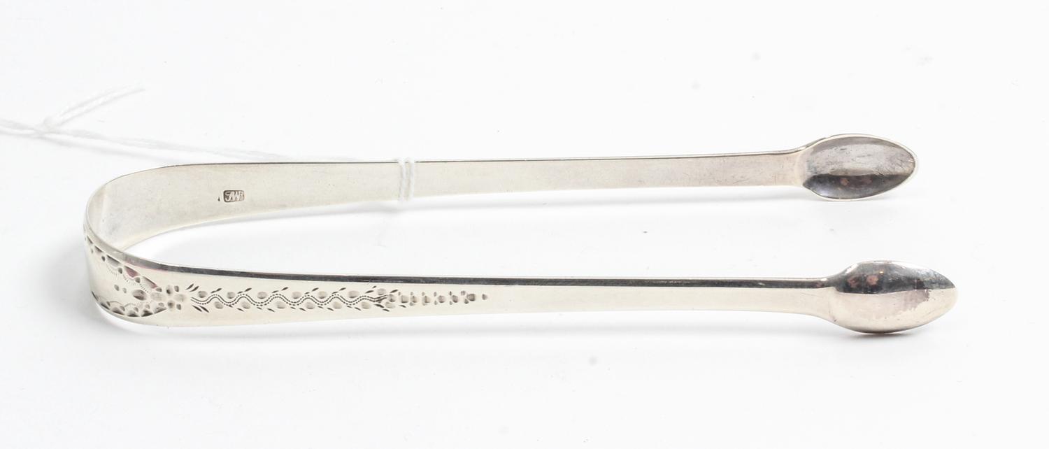 A George III Silver Sugar Tongs, Possibly John Whiting, London, 1800, the exterior decorated with wrigglework and foliate motifs.