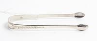 A George III Silver Sugar Tongs, Possibly John Whiting, London, 1800, the exterior decorated with wrigglework and foliate motifs.