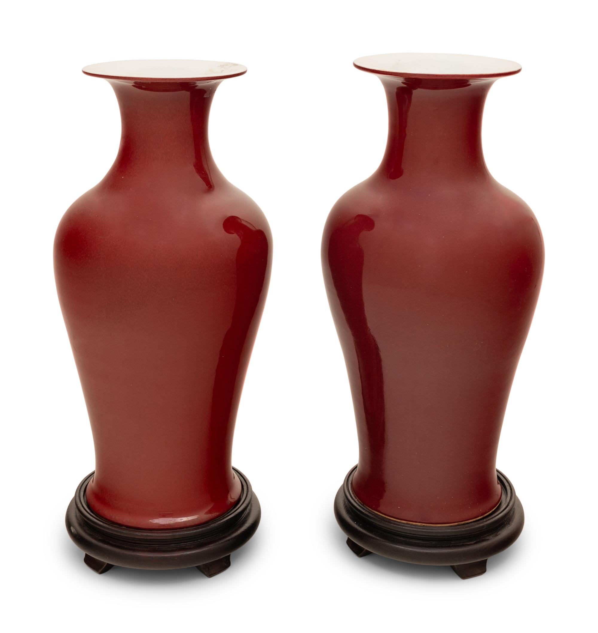 A Pair of Chinese Red Glazed Vases on Stands