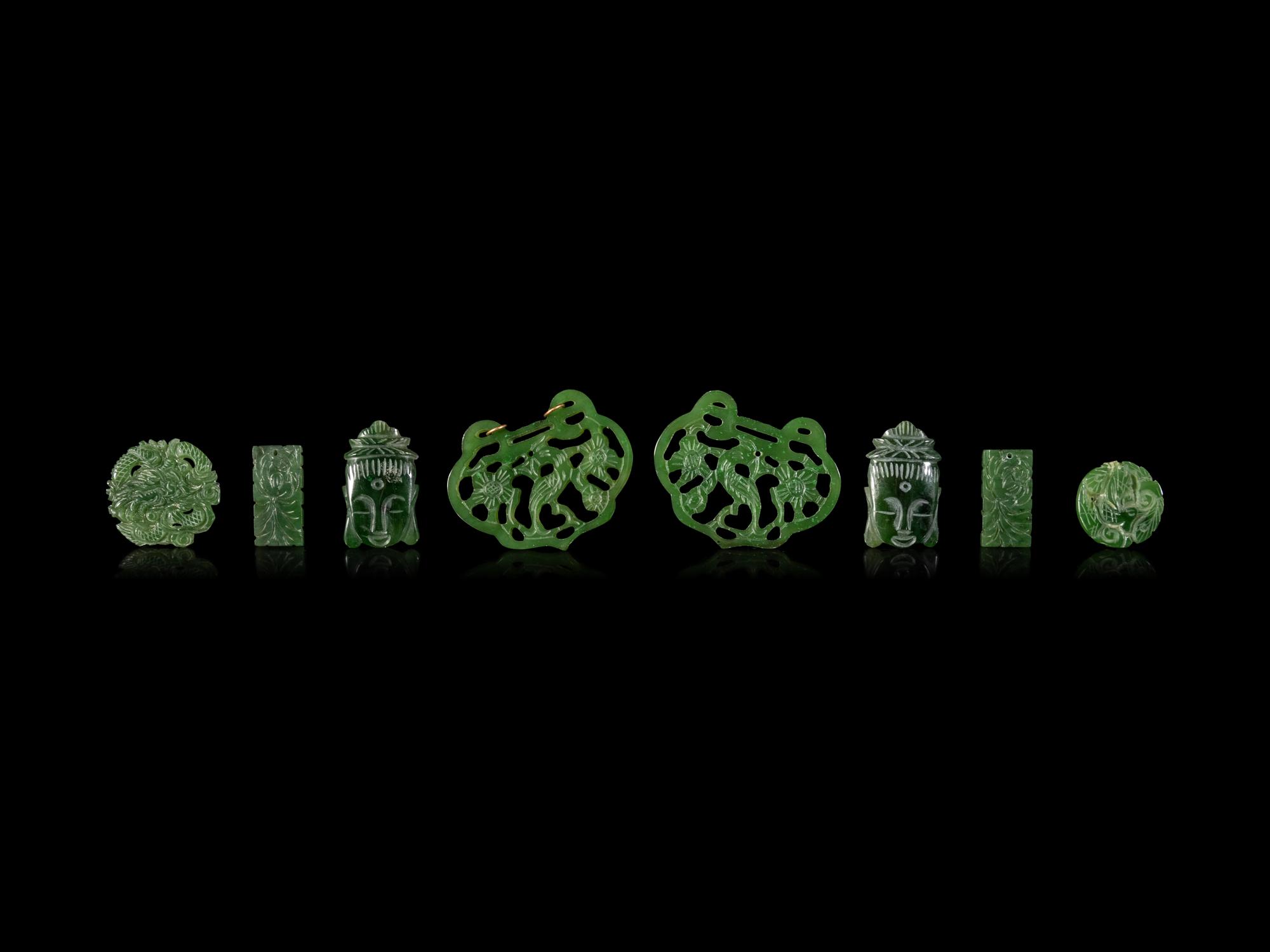 Twenty-One Chinese Spinach Jade Pendants
