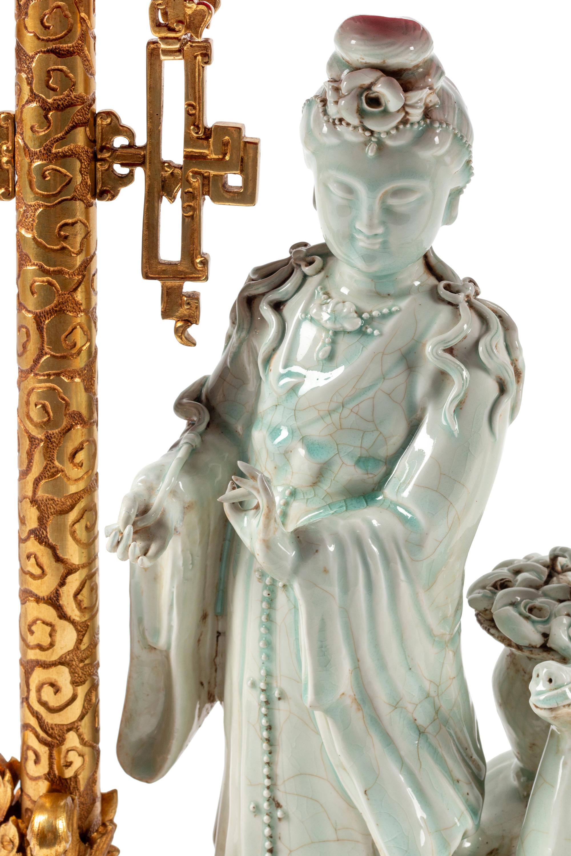 A Continental Gilt Bronze and Celadon Porcelain Figural Chinoiserie Clock