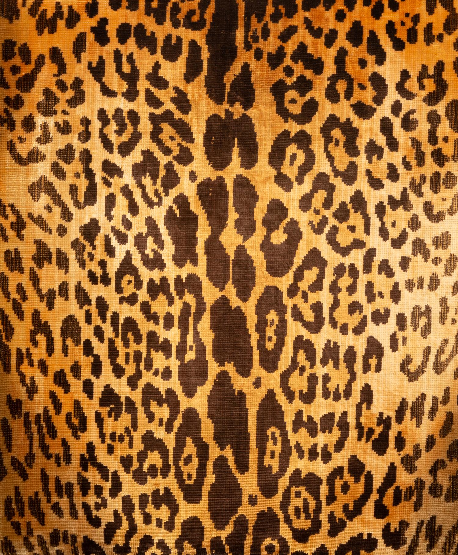 A George III Style Mahogany Wing Chair with Leopard Print Upholstery