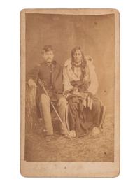 [NATIVE AMERICANS]. CROSS, William R. (1839-1907), photographer. CDV of Brulé Lakota Sioux Chief Hollow Horn Bear with an unidentified 5th US Cavalry second lieutenant. Niobrara, NE: [ca 1880].