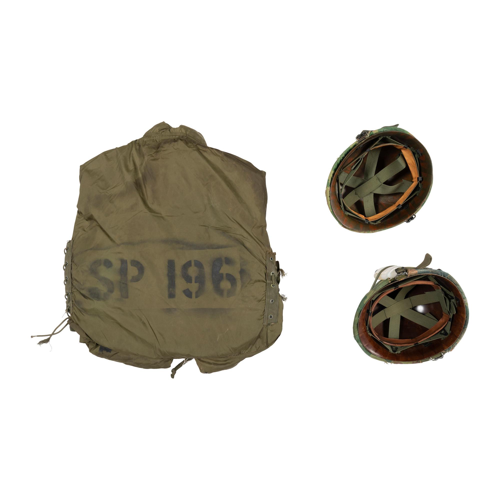 Group of Two Vietnam Era M1 Helmets and Flak Jacket