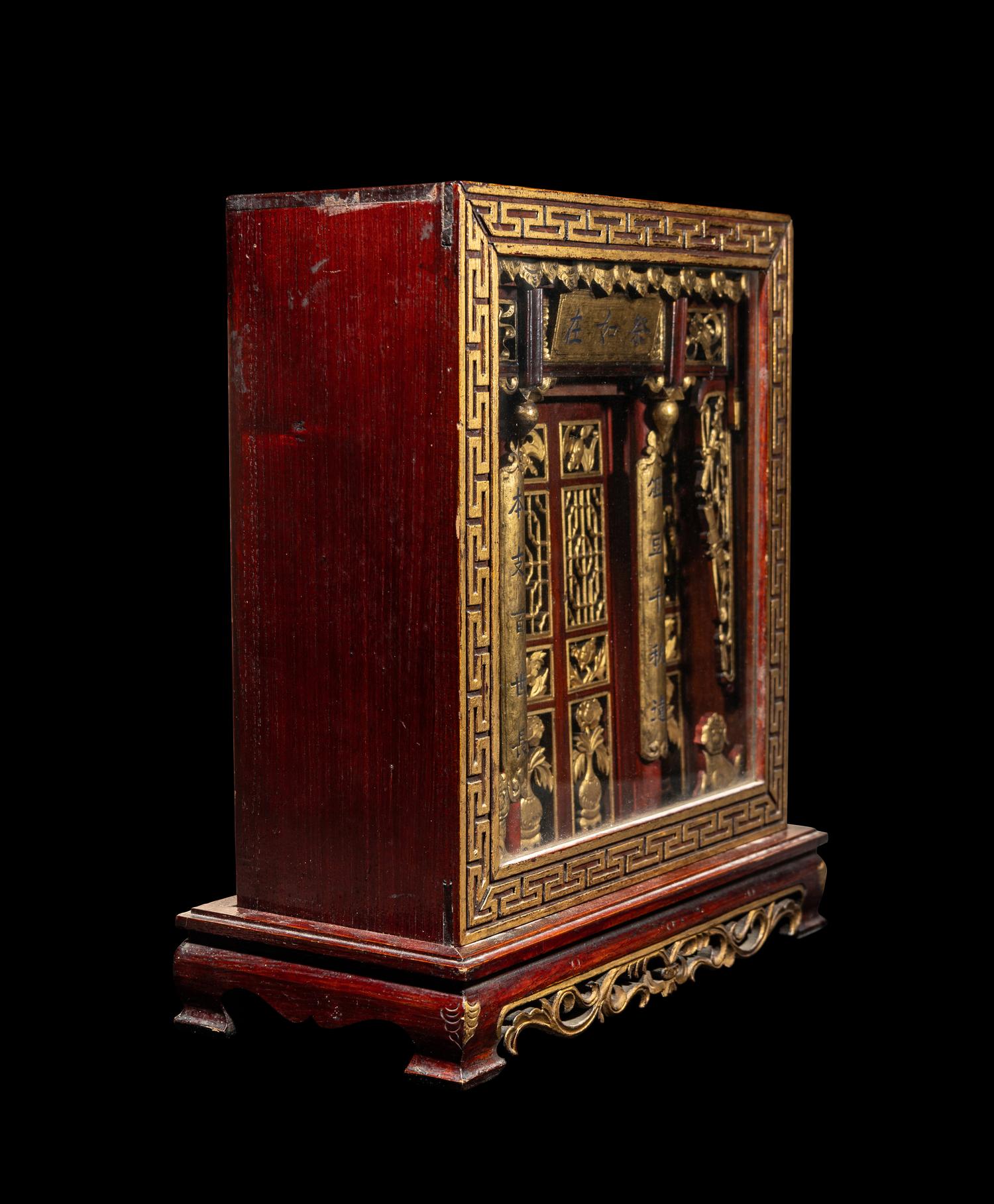 A Chinese Carved Gilt and Red Lacquered Wood Shrine